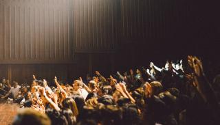 Large crowd voting in a hall