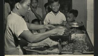 Colonial Malaya - Children receive free food at Kuala Lumpur clinic